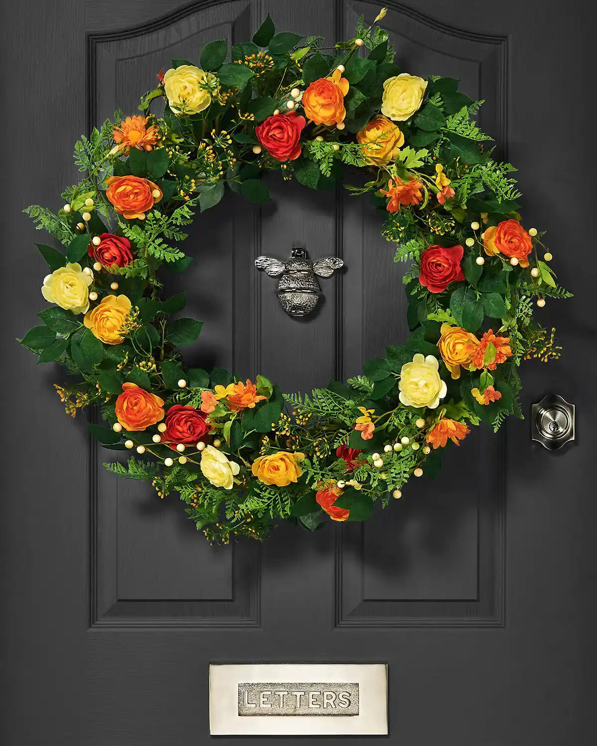 Orange, 28 Inch, Artificial Floral Rose Spring Wreath on a Black door.