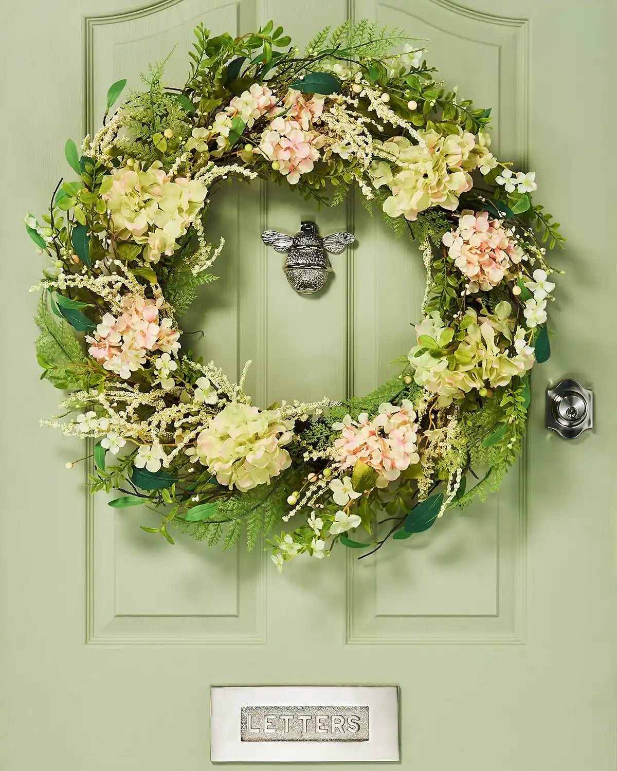 Peach and White, 28 Inch, Artificial Floral Hydrangea Spring Wreath,  on a Green door.