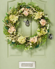 Peach and White, 28 Inch, Artificial Floral Hydrangea Spring Wreath,  on a Green door.