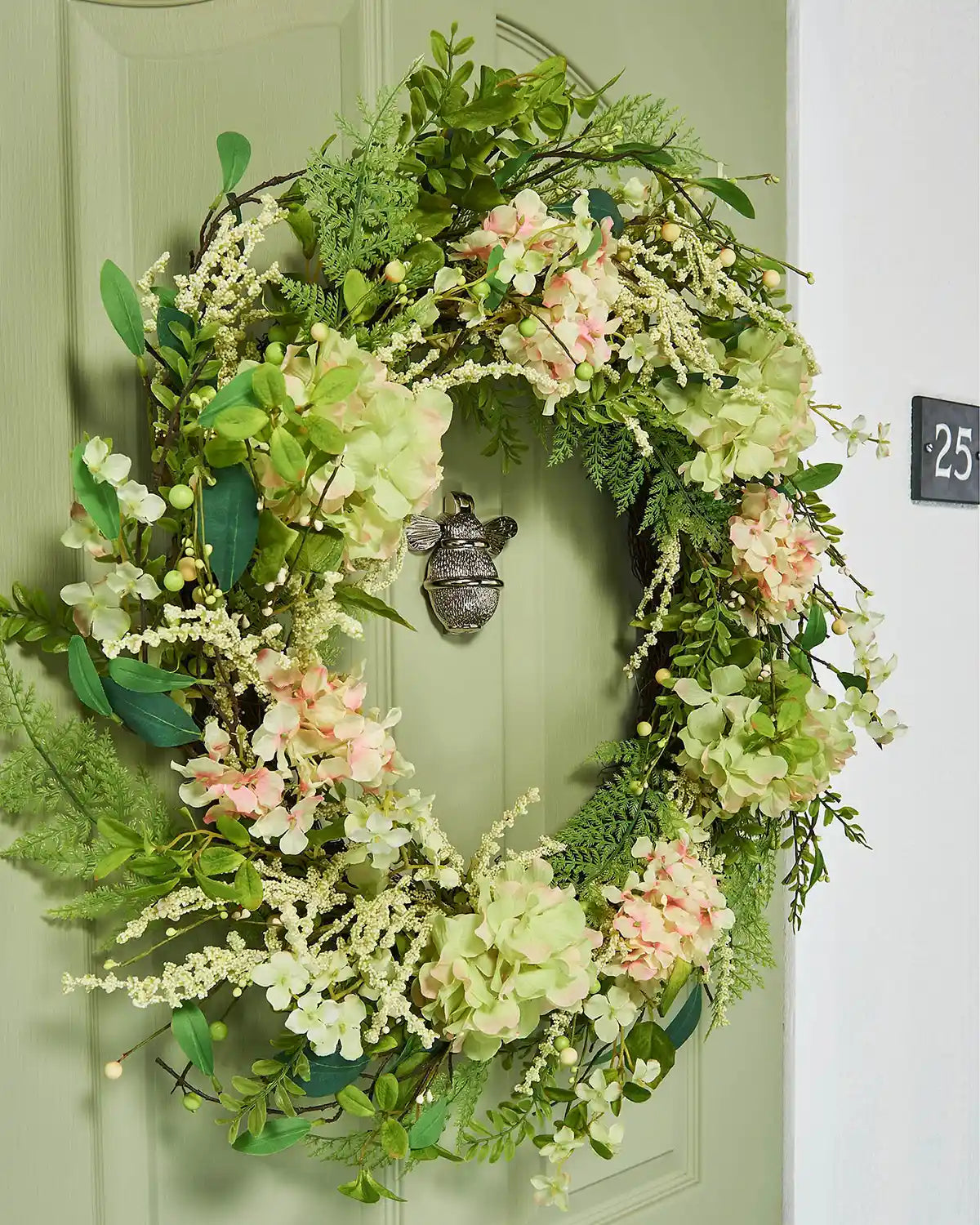 Peach and White, 28 Inch, Artificial Floral Hydrangea Spring Wreath,  on a Green door, left side.