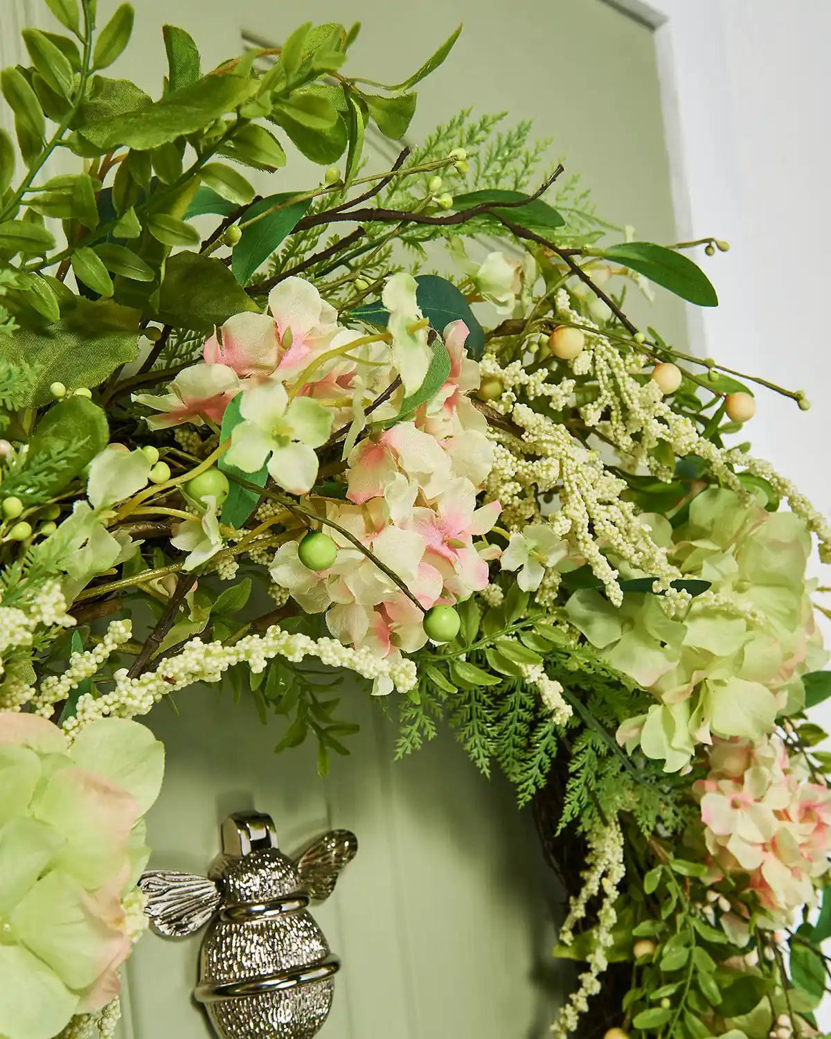 Peach and White, 28 Inch, Artificial Floral Hydrangea Spring Wreath,  on a Green door, top, close up.
