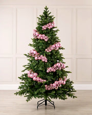 Pink Bauble Cluster Arch decorating a Christmas tree, with glossy, matte, and glitter pink baubles