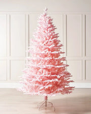 Pink Christmas tree against a cream panel wall