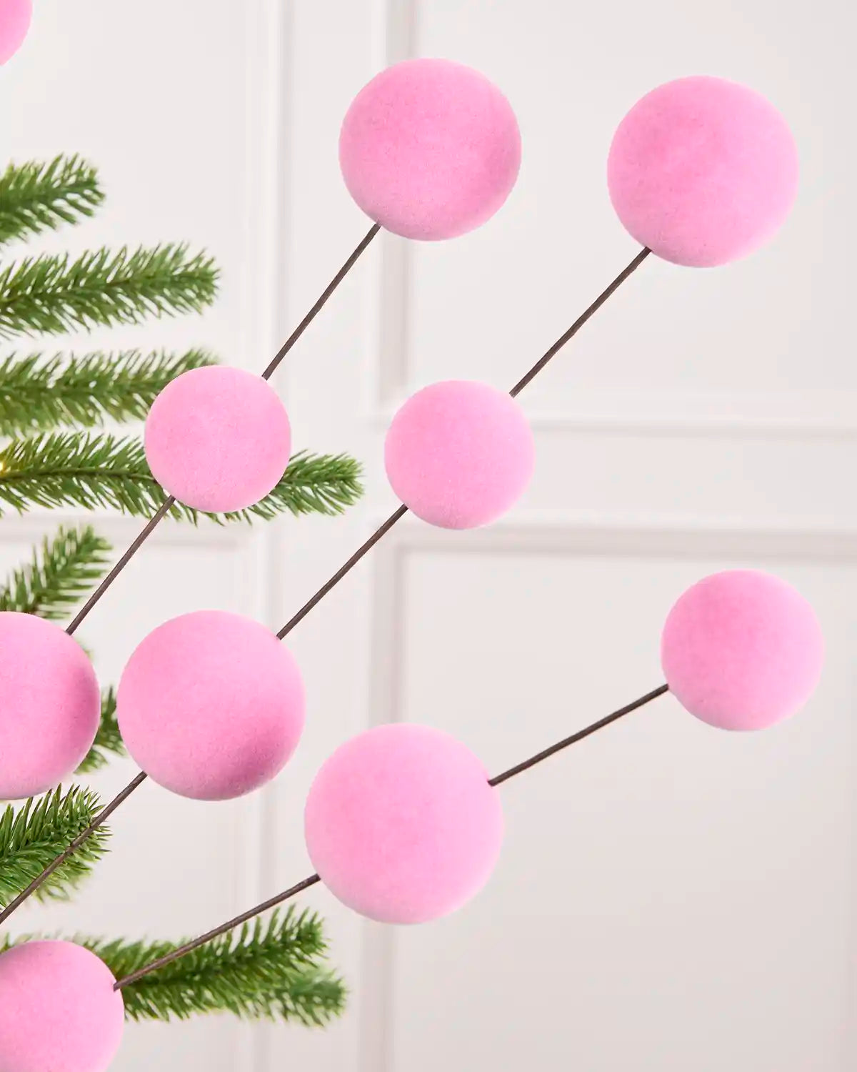 Pink Velvet Bauble Picks displayed on Christmas tree branches