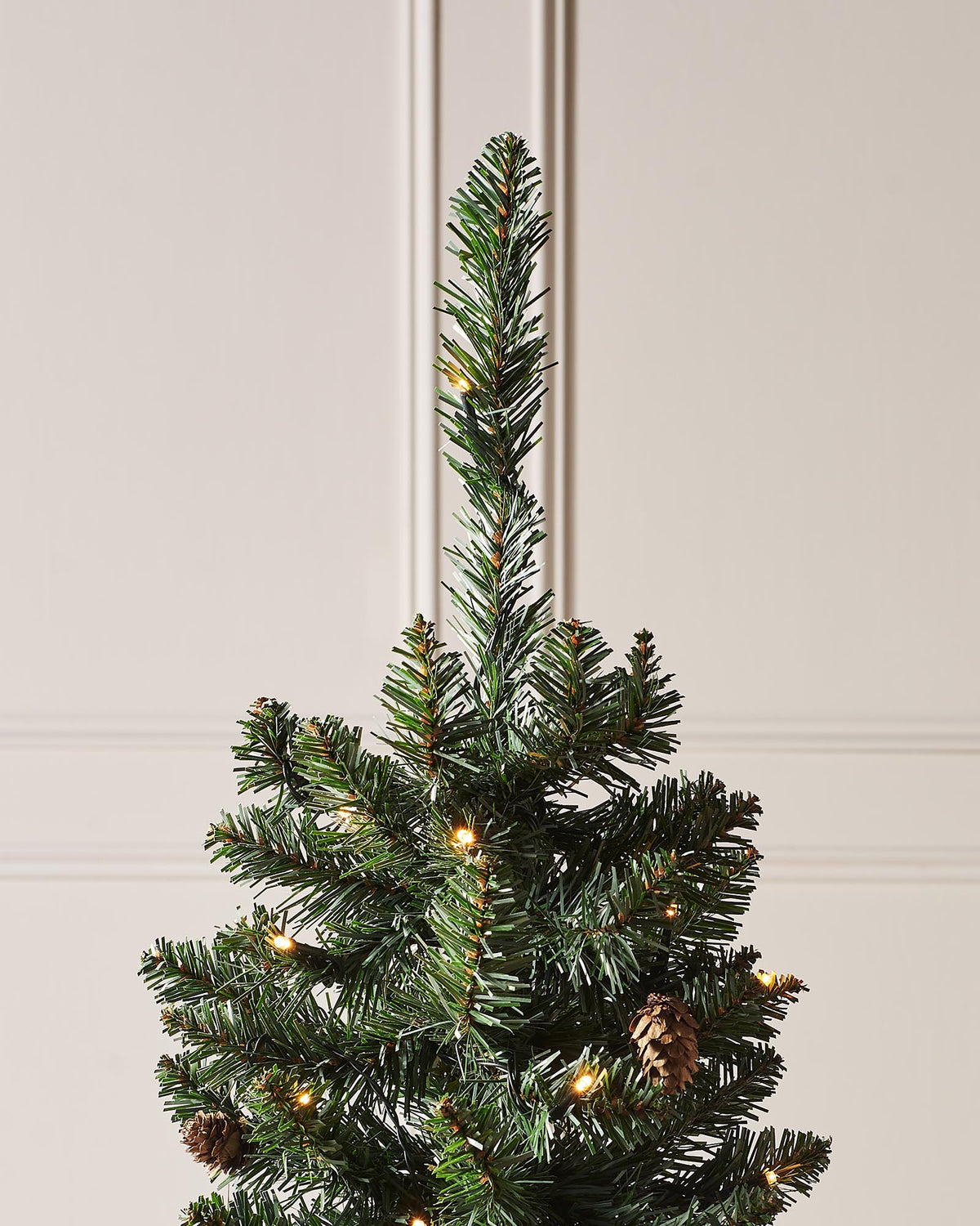 Pre-lit 46 cm (18 inch) potted Craford Pine Christmas tree with 150 lush PVC tips and 80 warm white LED lights—compact, elegant, and glowing with festive warmth, perfect for mantles, tabletops, or cosy indoor corners.