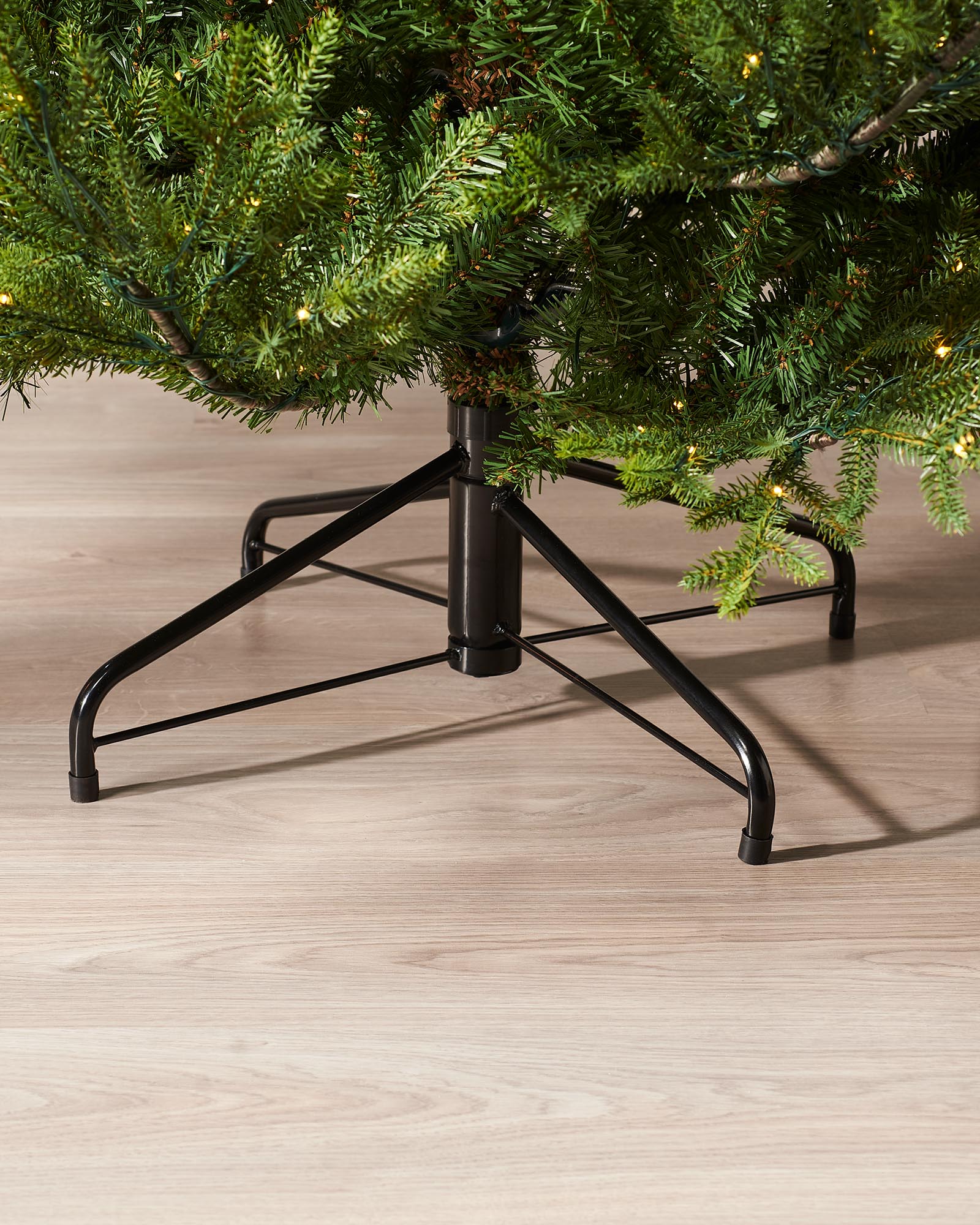 Pre-lit artificial Douglas Fir Christmas tree with warm white copper wire LED lights, available in green or snow-flocked finish, featuring lifelike PE and PVC branches and 8 lighting functions, displayed against a plain background.