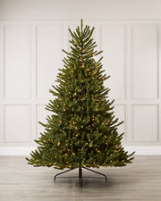 Pre-Lit Empress Fir Christmas Tree with warm white lights, shown fully assembled