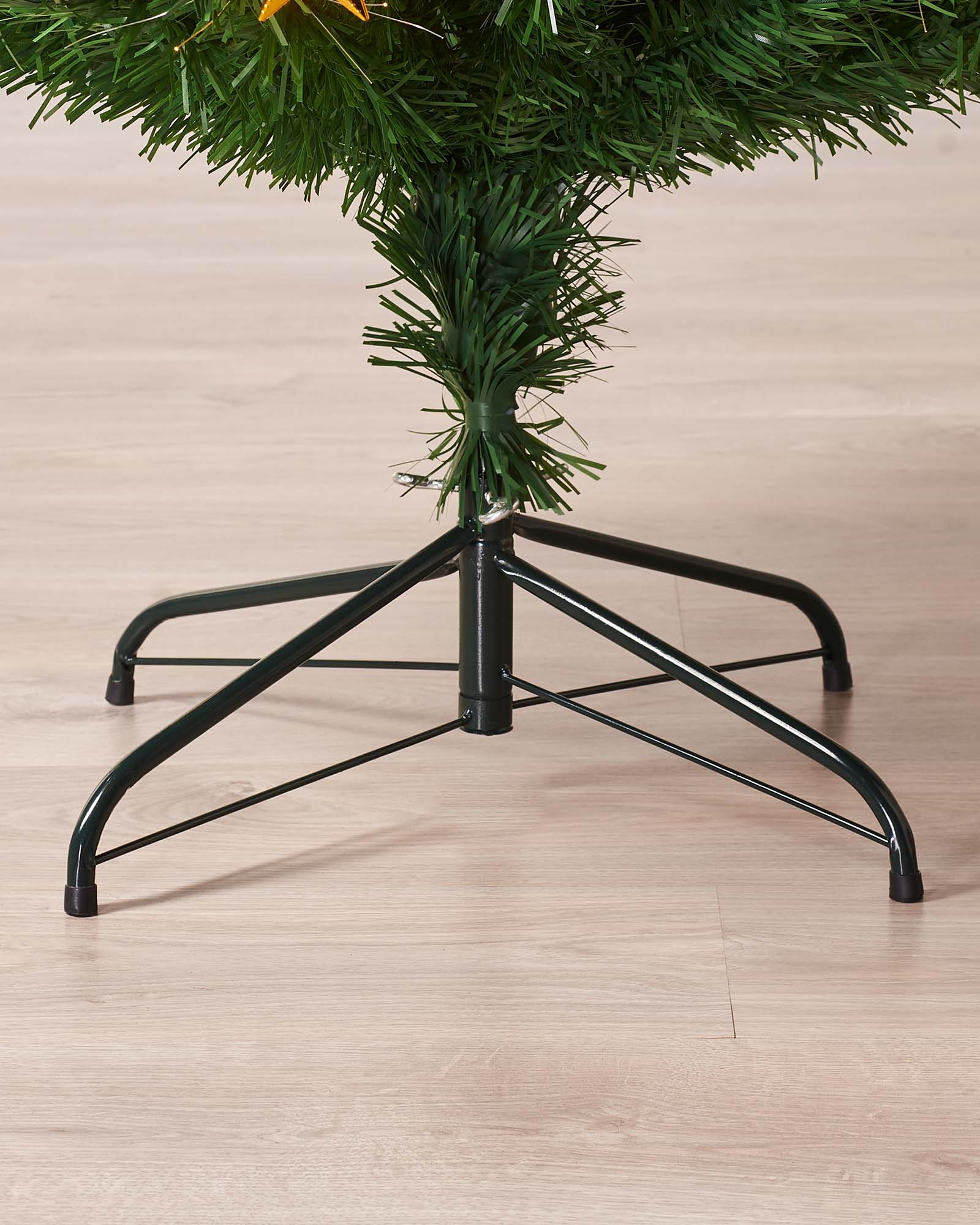 7-foot pre-lit green artificial Christmas tree with 270 warm white fibre optic tips and 60 gold LED star decorations, featuring 8 lighting functions and an LED star topper, displayed indoors against a white background.