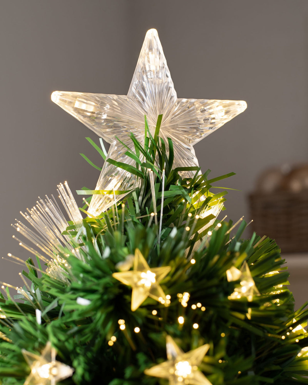 7-foot pre-lit fibre optic pencil Christmas tree with 290 fibre optic tips, 294 warm white LEDs, and an LED star topper, featuring a slim 70 cm diameter and displayed indoors.