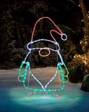 Pre-Lit Gonk Rope Light Silhouette with green, white, red and Gold LEDs throughout. Held up with a stand in a garden setting