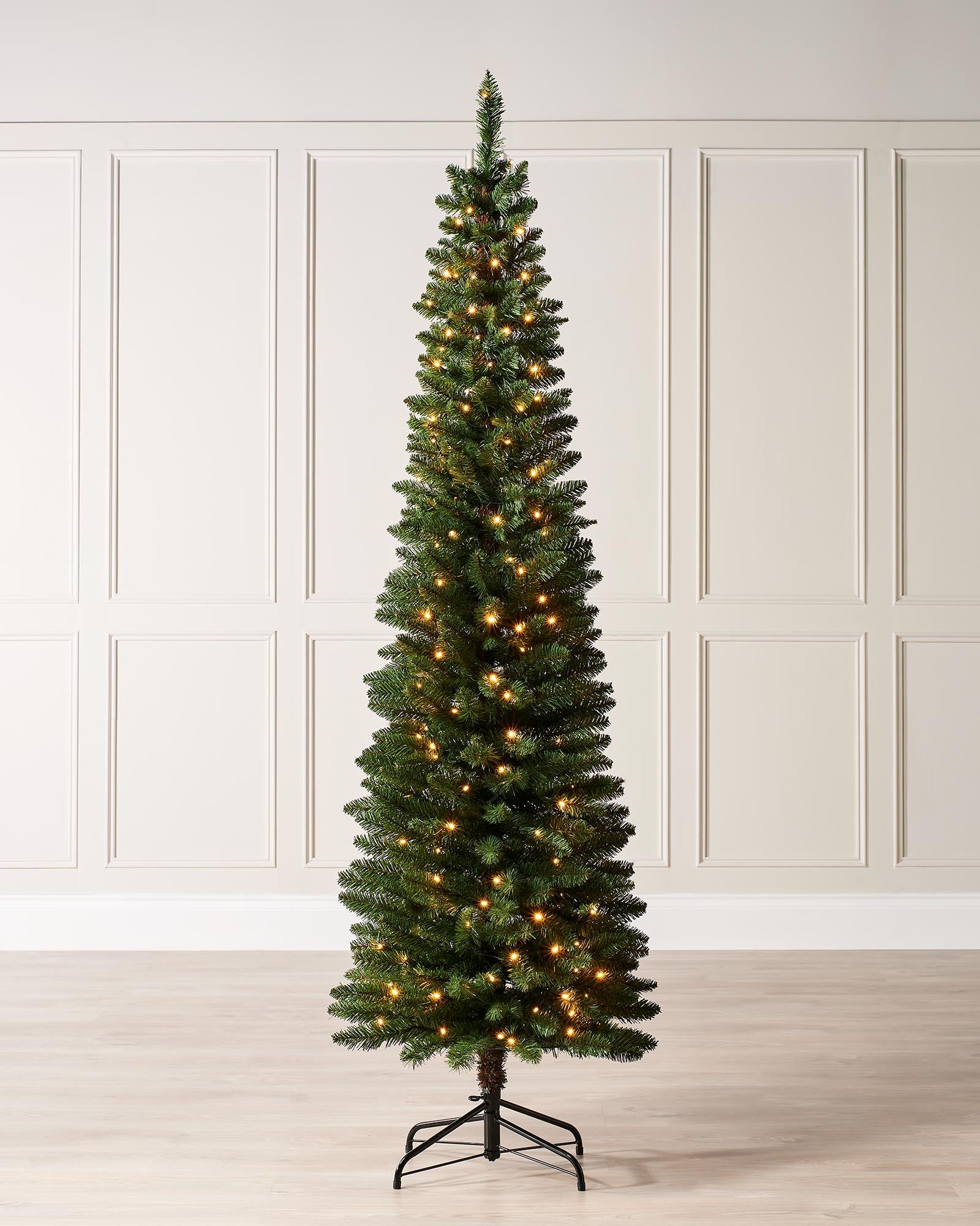 Pre-lit green pencil Christmas tree with slender shape, 400 mixed PE and PVC tips, and warm white LED lights, displayed indoors against a white background.