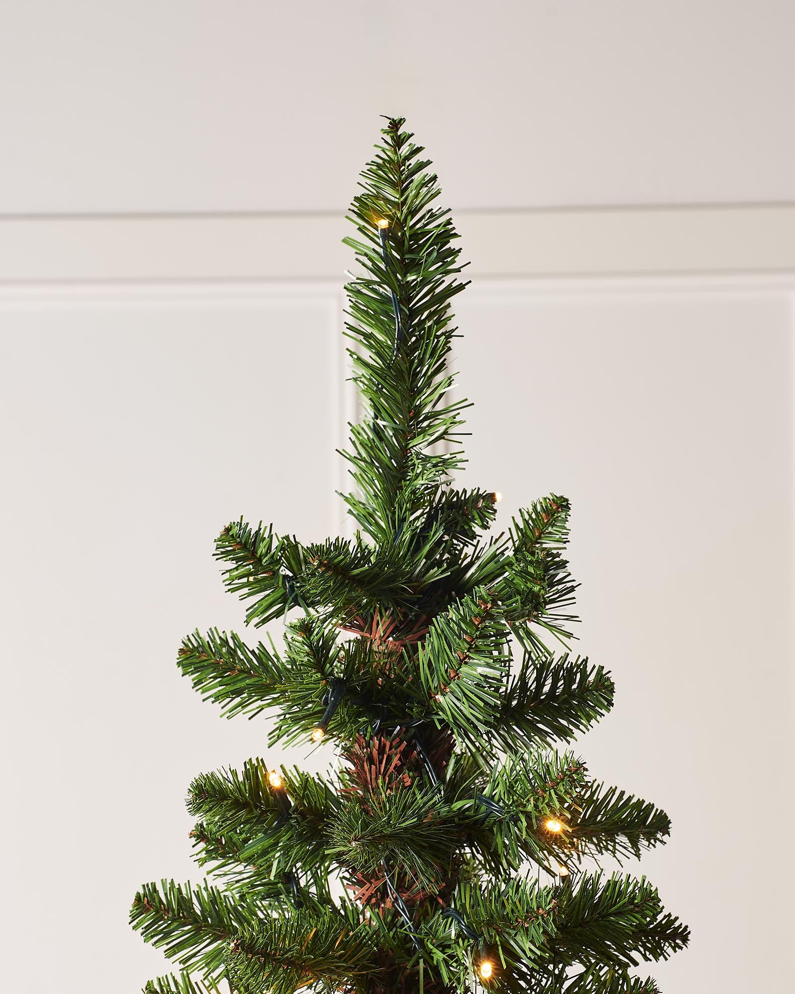 Pre-lit green pencil Christmas tree with slender shape, 400 mixed PE and PVC tips, and warm white LED lights, displayed indoors against a white background.
