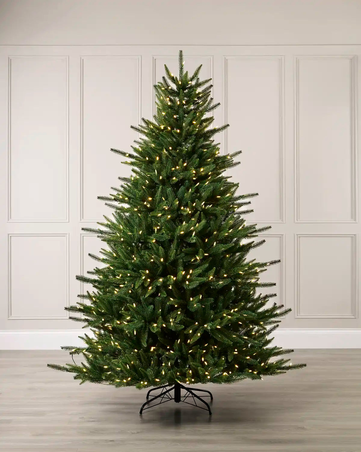 Pre-Lit Hawthorn Spruce Christmas Tree with warm white lights, shown fully assembled