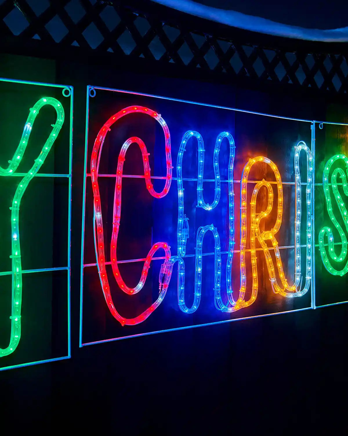 Close up of Multi coloured letters Y C H R I S part of the Pre-Lit Merry Christmas, Multi-Coloured, Silhouette, 292 cm