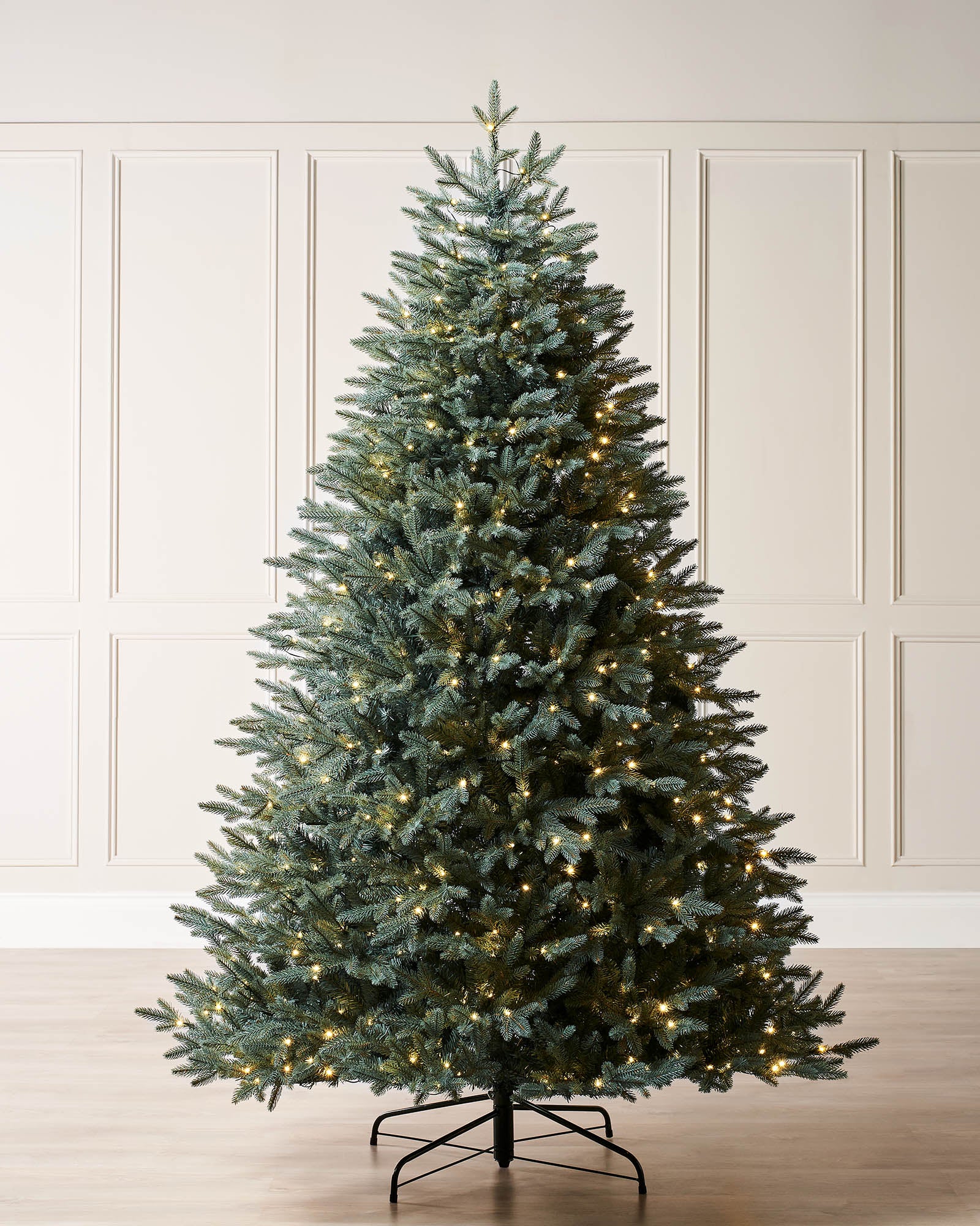 Pre-lit Blue Mixed Pine Christmas tree with lifelike mixed tips and hinged branches for easy setup. Features dual LED warm white and white lights with multi-function memory controller, displayed against a neutral background.