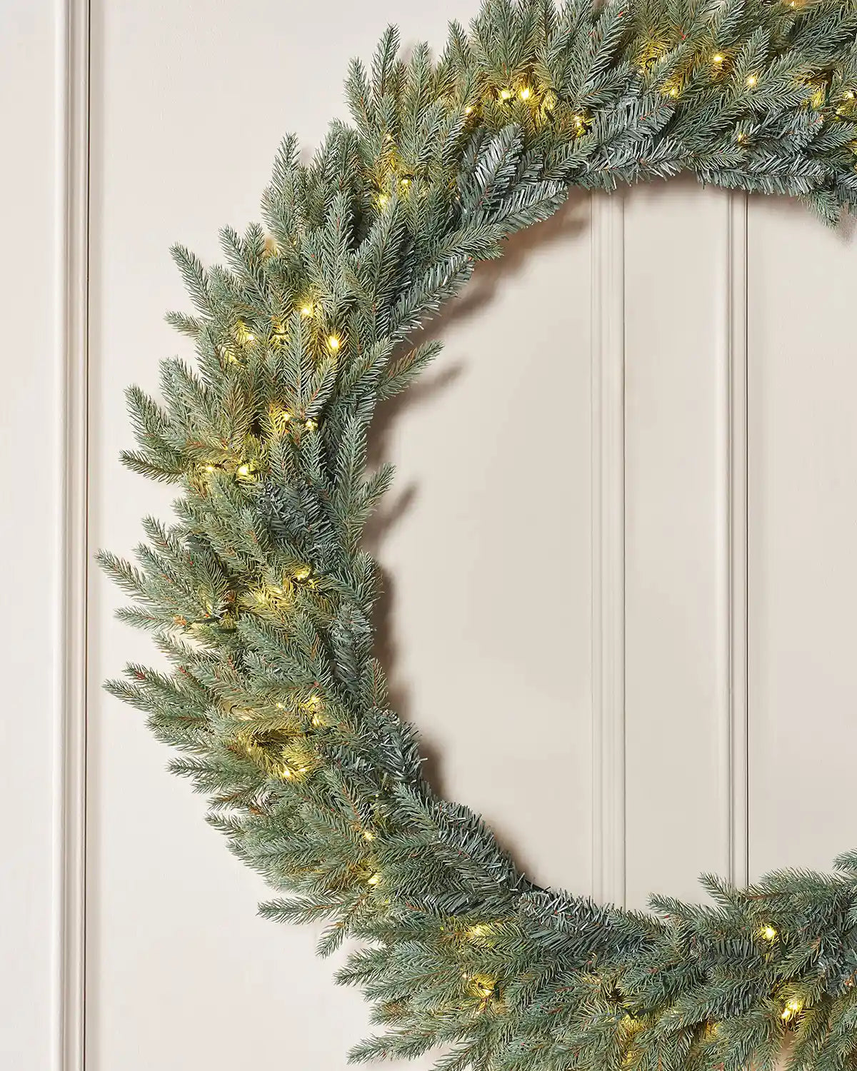 Pre-Lit Mixed Pine Blue Wreath, 1 m side view with warm white lights