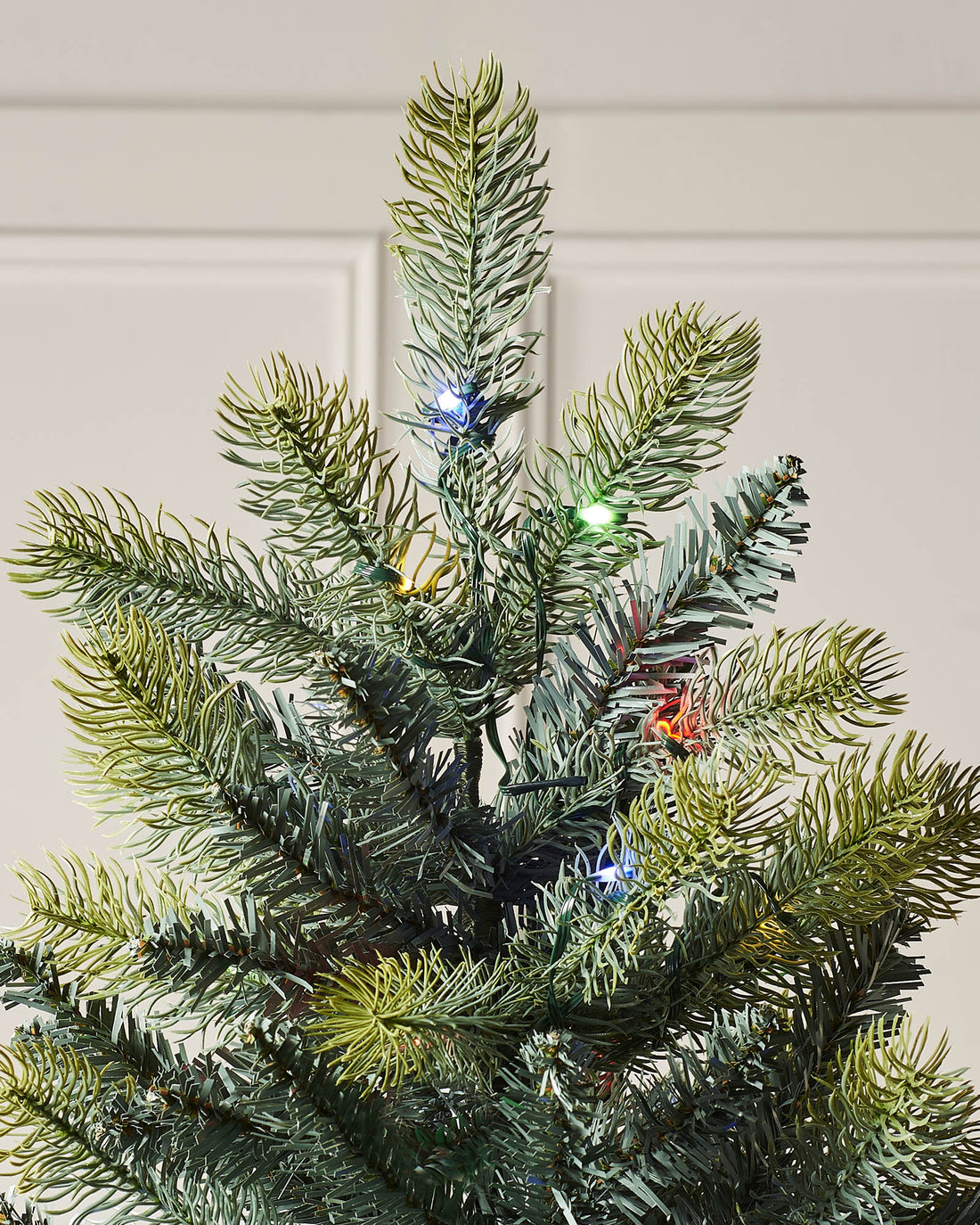 Pre-lit mixed pine artificial Christmas tree with dual LED lights in warm white and multicolour, displayed against a plain background."