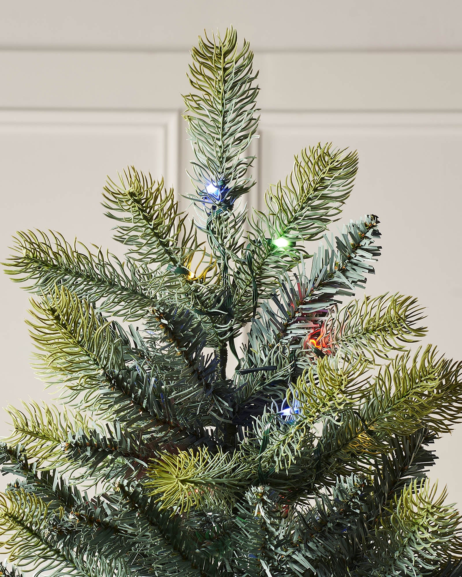 Pre-lit mixed pine artificial Christmas tree with dual LED lights in warm white and multicolour, displayed against a plain background."