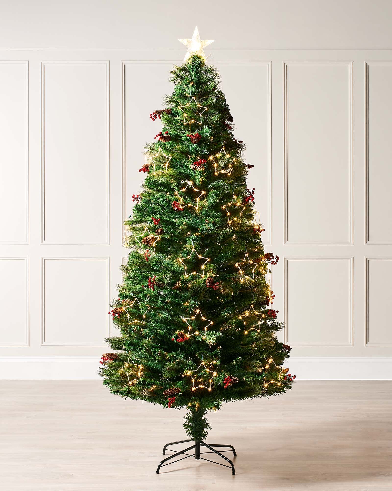 Pre-lit 5-foot mixed pine fibre optic Christmas tree with warm white LEDs, decorative pinecones and berries, and LED star topper, placed on a stand and adorned with ornaments.
