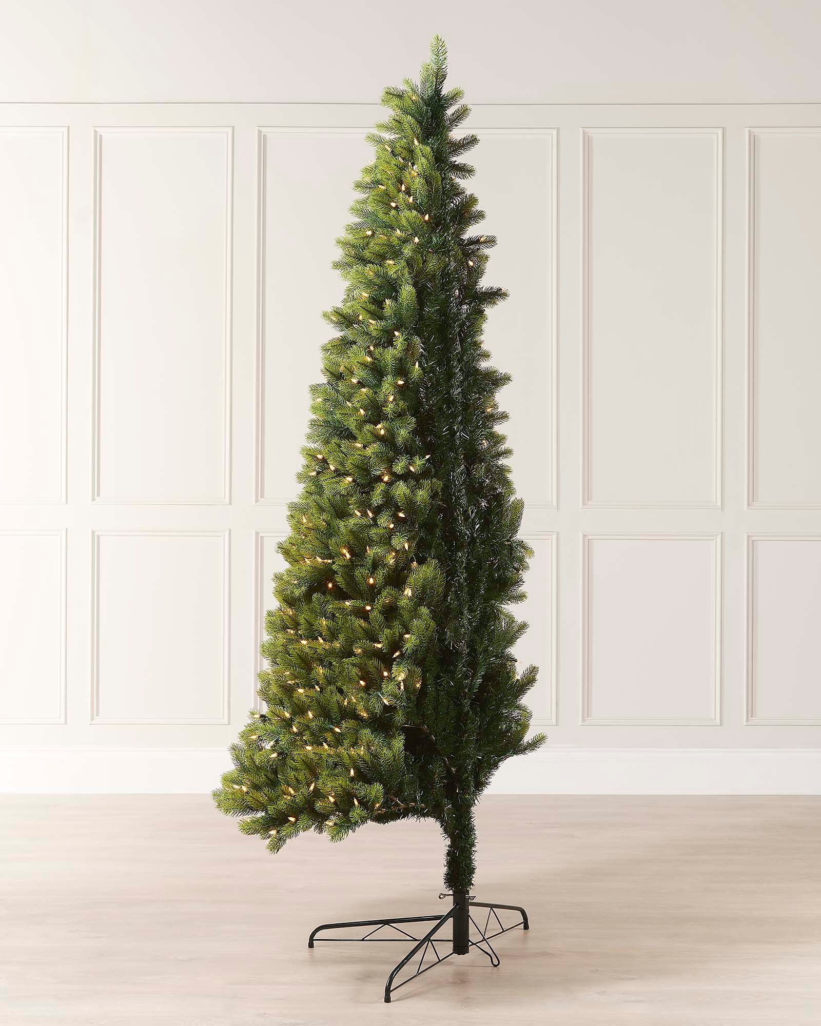 A 5-foot pre-lit mixed pine half Christmas tree with metal stand.