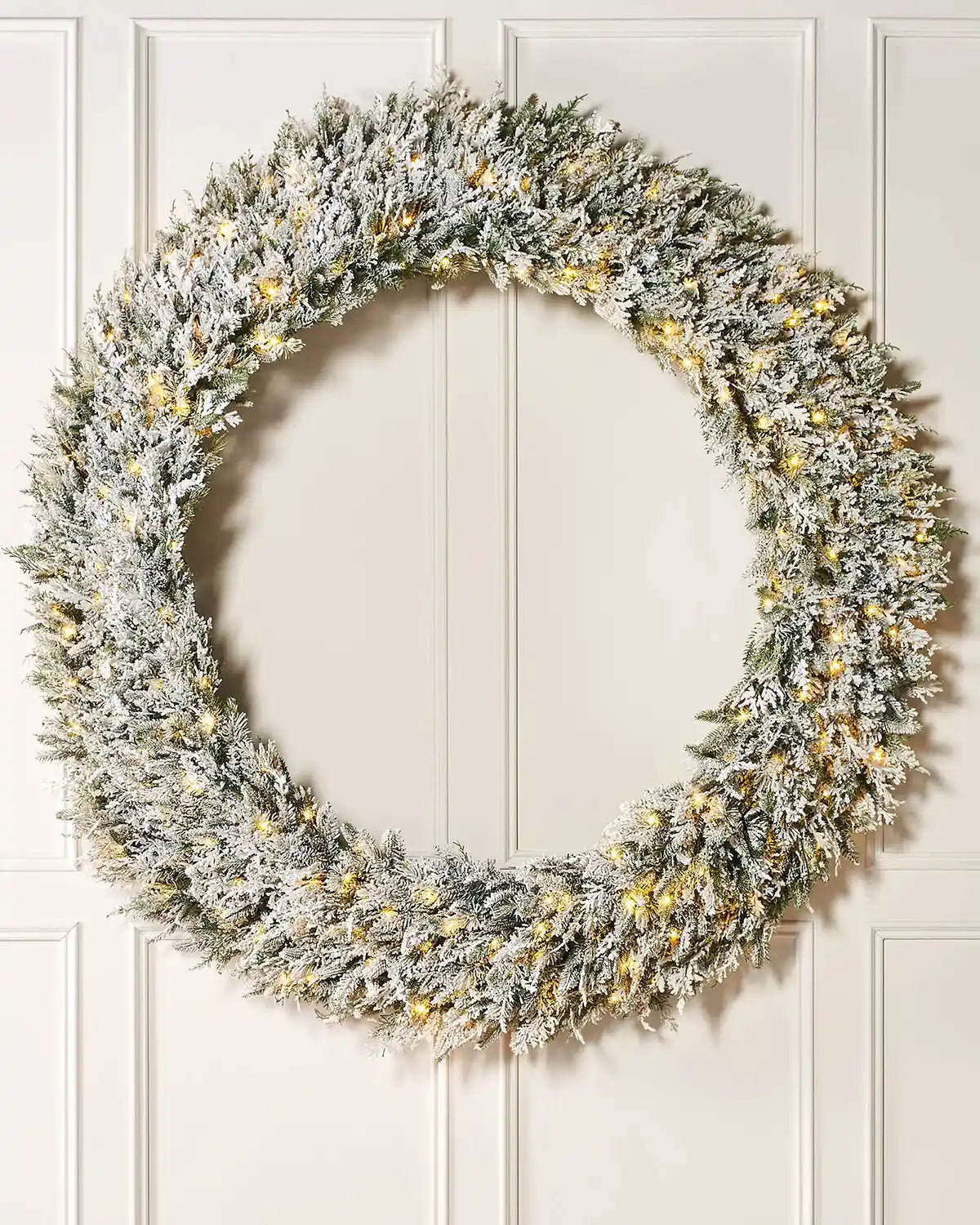 Pre-Lit Snow Flocked Natural Fir Majestic Wreath, 1.5 m on panel textured background