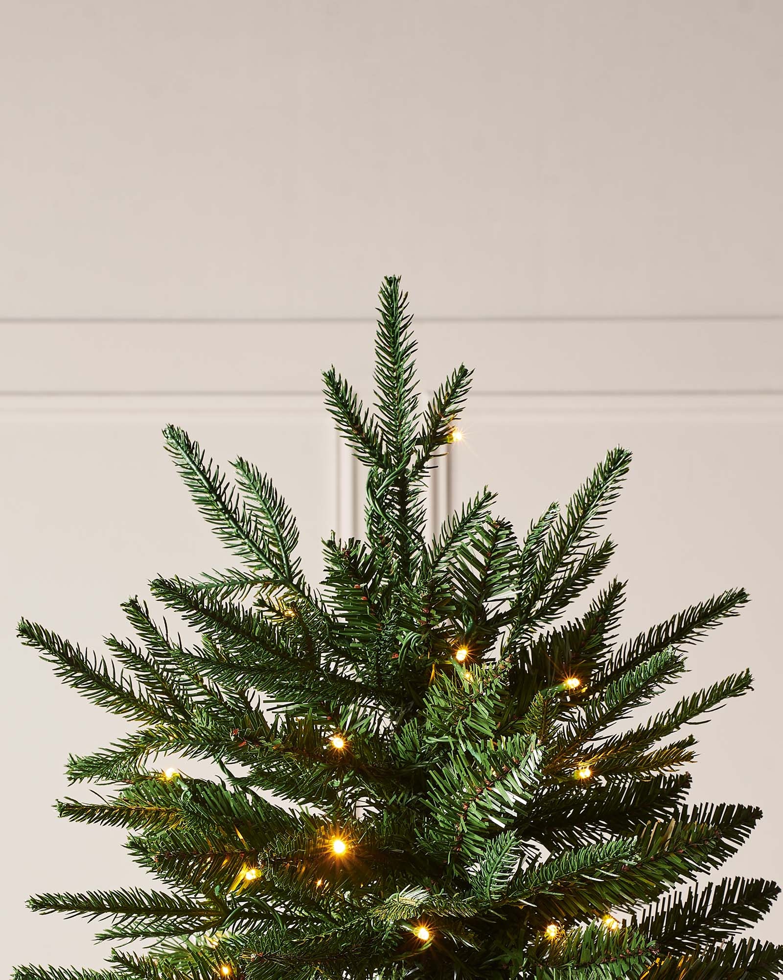 5 ft pre-lit Grand Alaskan Fir Christmas tree with mixed PE and PVC branches, featuring dual warm white and multi-colour LED lights with multi-functional settings, displayed against a neutral background.