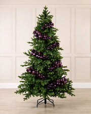 Purple Bauble Cluster Arch decorating a Christmas tree, with glossy, matte, and glitter purple baubles
