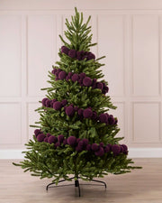 Purple Velvet Bauble Garland decorating a Christmas tree, featuring purple velvet baubles arranged along the garland.