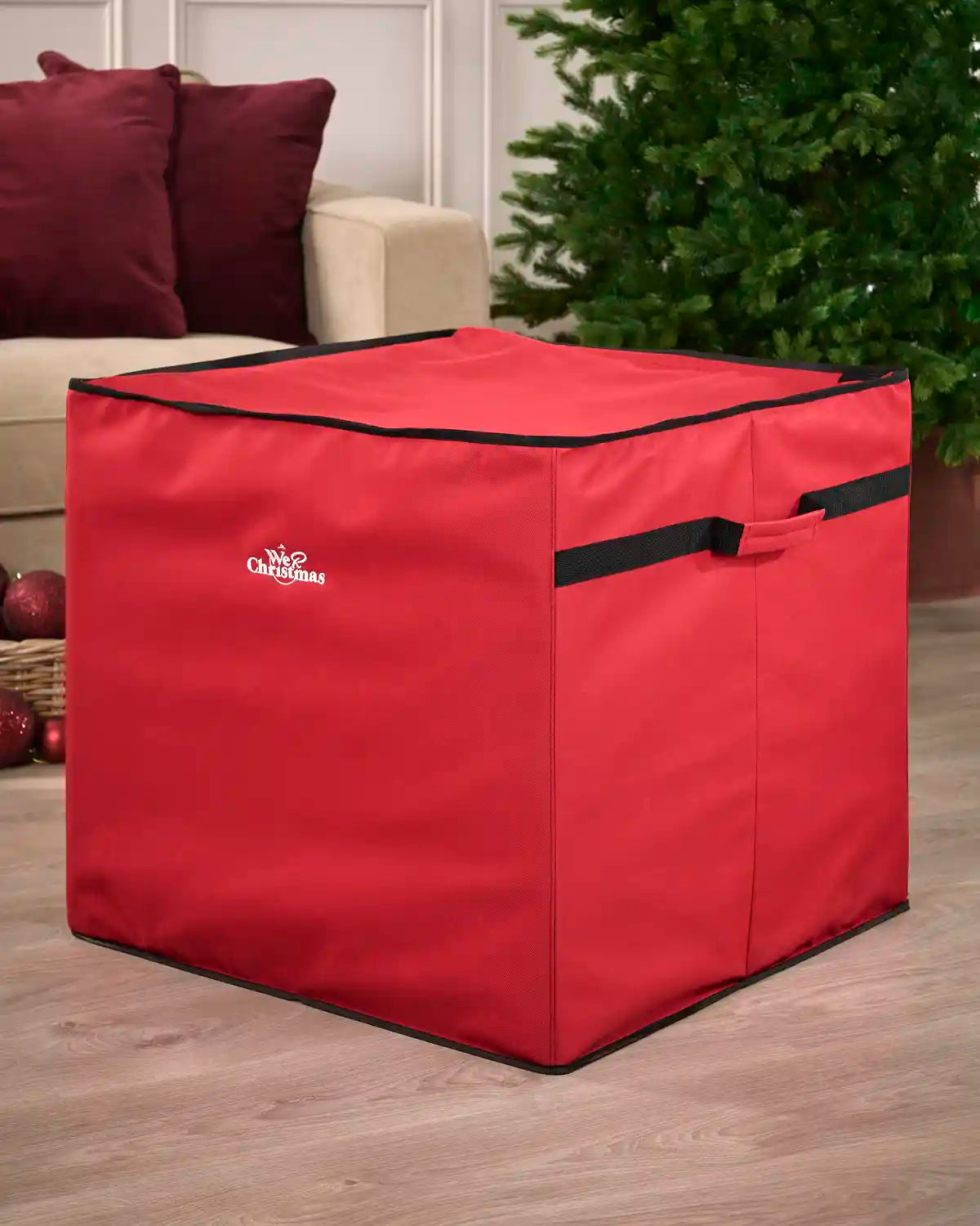 Red 60 cm Christmas decoration storage bag shown closed, with a fitted lid, black trim and front carry handle