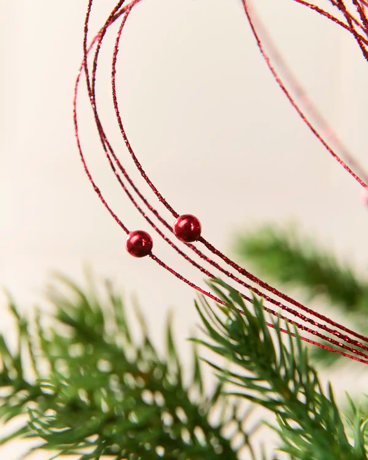 Red Glitter Nest Christmas Tree Pick highlighting the glitter details and 2 red balls