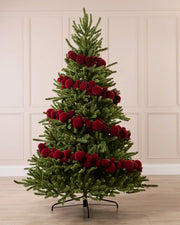 Red Velvet Bauble Garland decorating a Christmas tree, featuring red velvet baubles