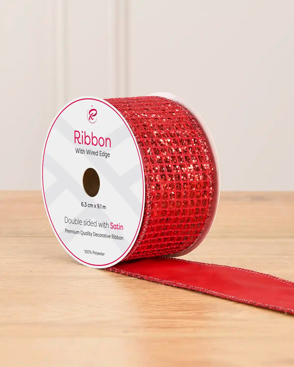 Red square ice Chip double sided ribbon on a wooden table against a light background