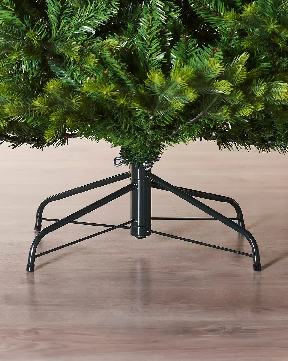 Close up of the top of the tree base and Black Tree stand Regent Pine Mixed Tip Christmas Tree, 8ft