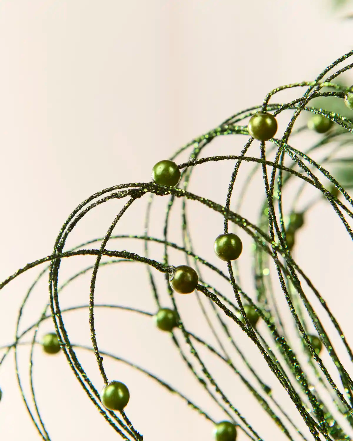 Sage green Glitter Nest Christmas Tree Pick highlighting the glitter details and Sage green balls
