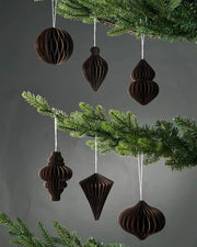Set of 6 10cm espresso paper honeycomb tree decorations hanging on Christmas tree in front of grey wall background