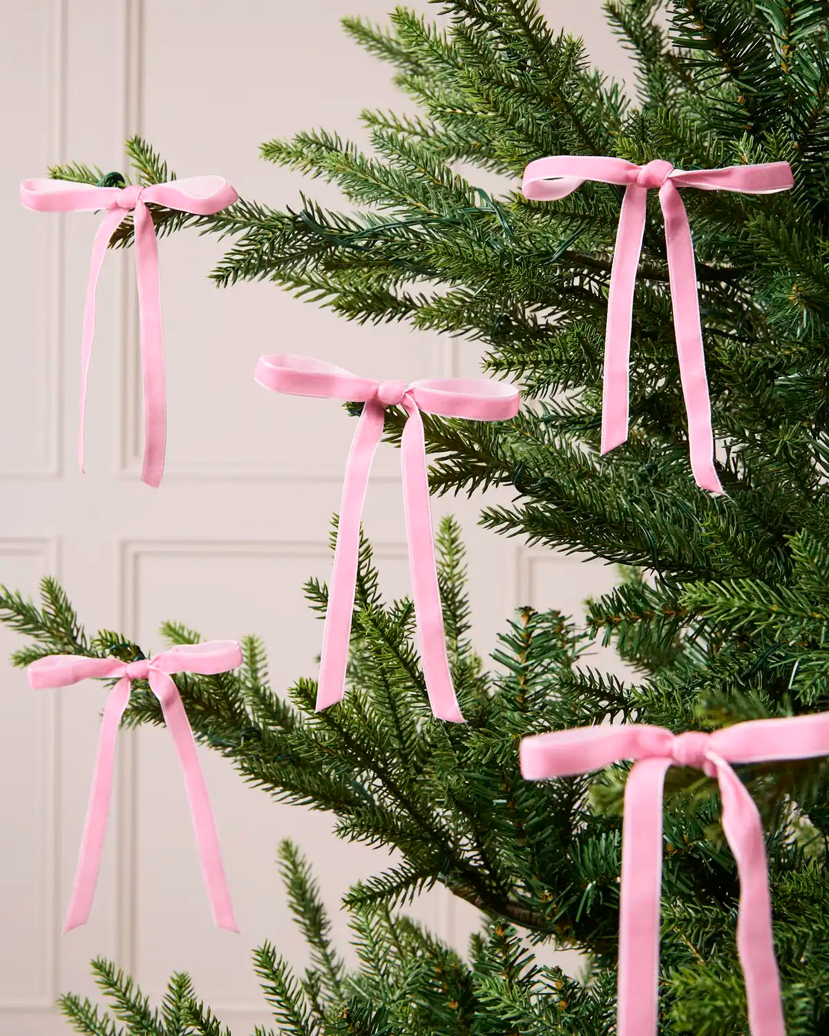 Set of Pink Velvet Bows decorating a Christmas tree
