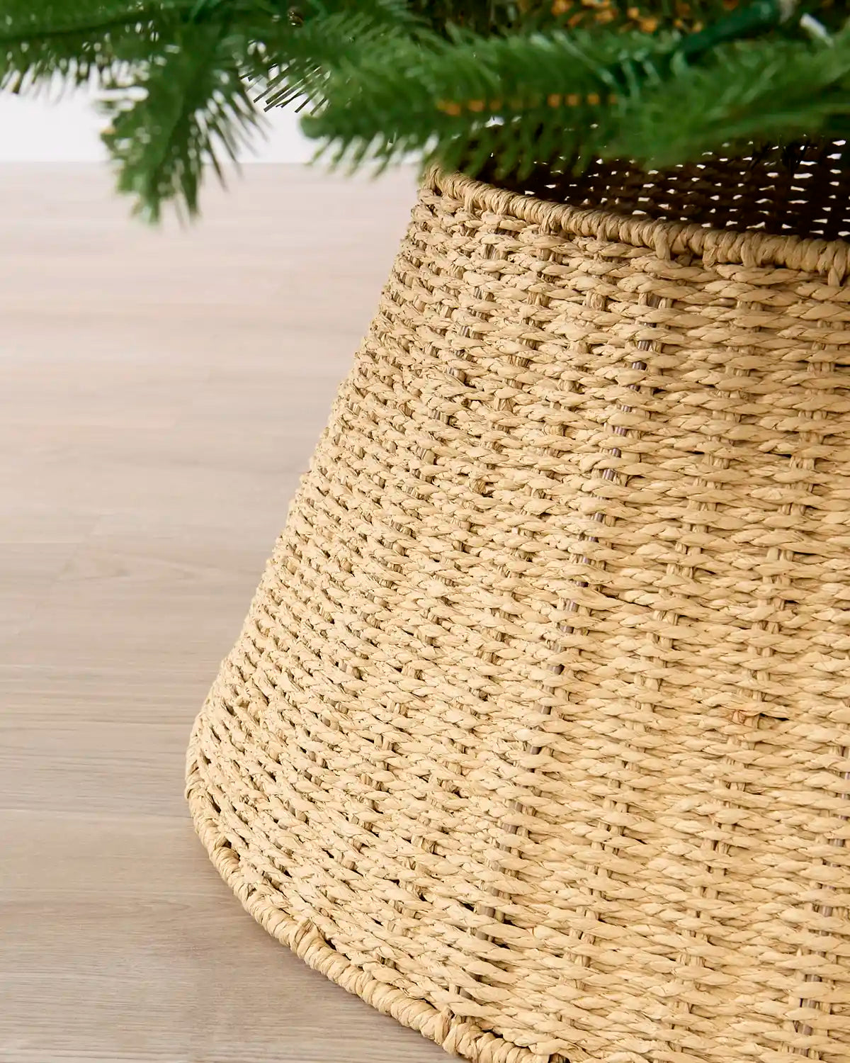 Side view of Knitted Rattan Christmas Tree Collar highlighting its tapered shape and woven construction