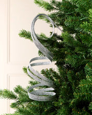 Silver Glitter Spiral Swirl Pick hanging from Christmas tree branch with cream background
