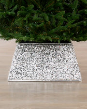 Silver Sequin Tree Collar surrounding the base of a Christmas tree