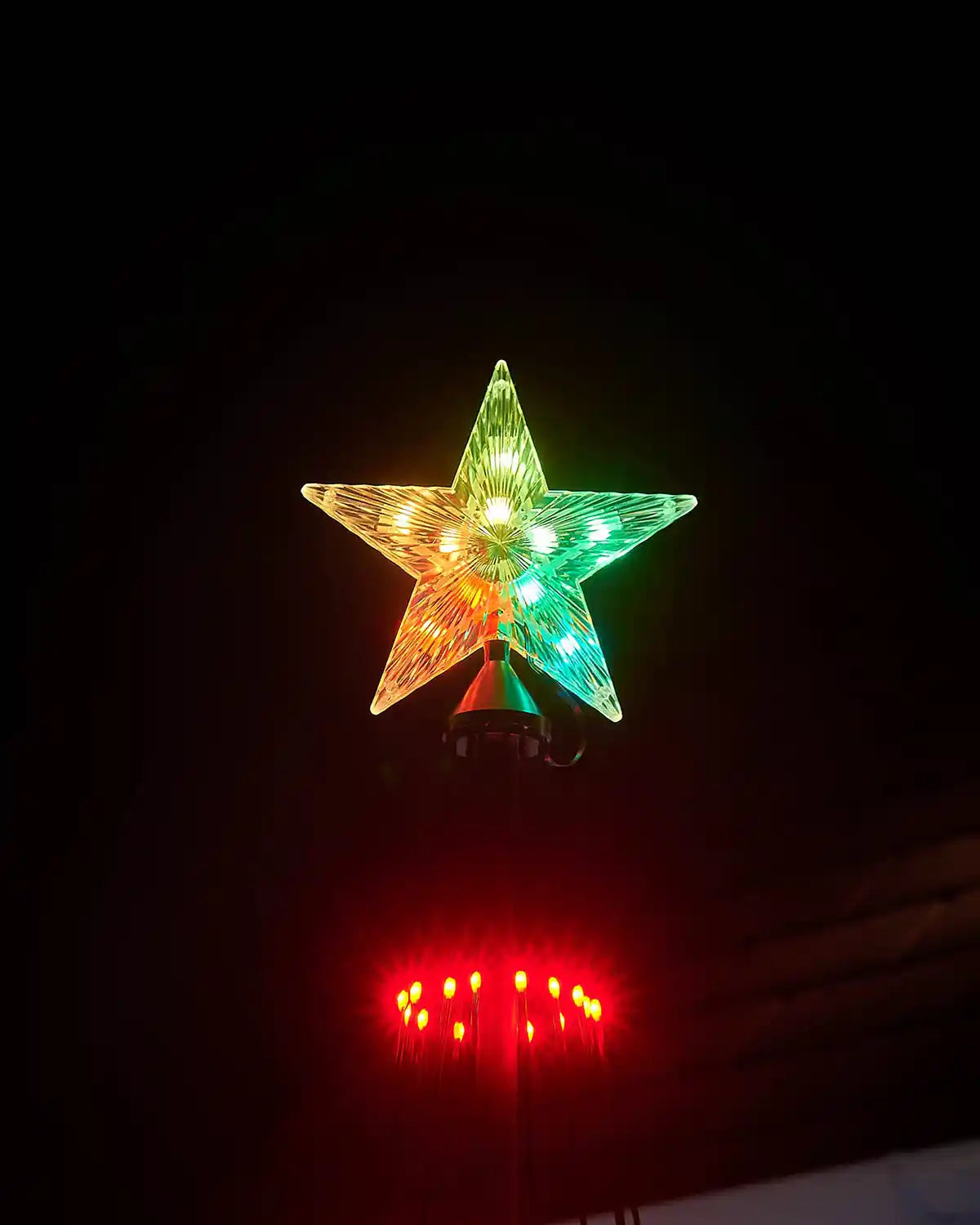 Star-shaped light fixture on a dark background