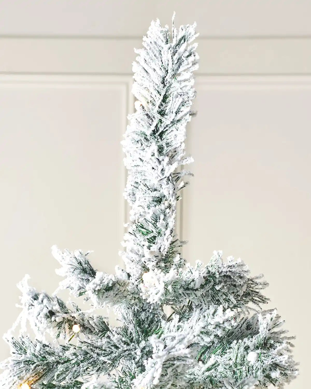 Top of 7ft Christmas tree with snow flocked PVC and PE tips