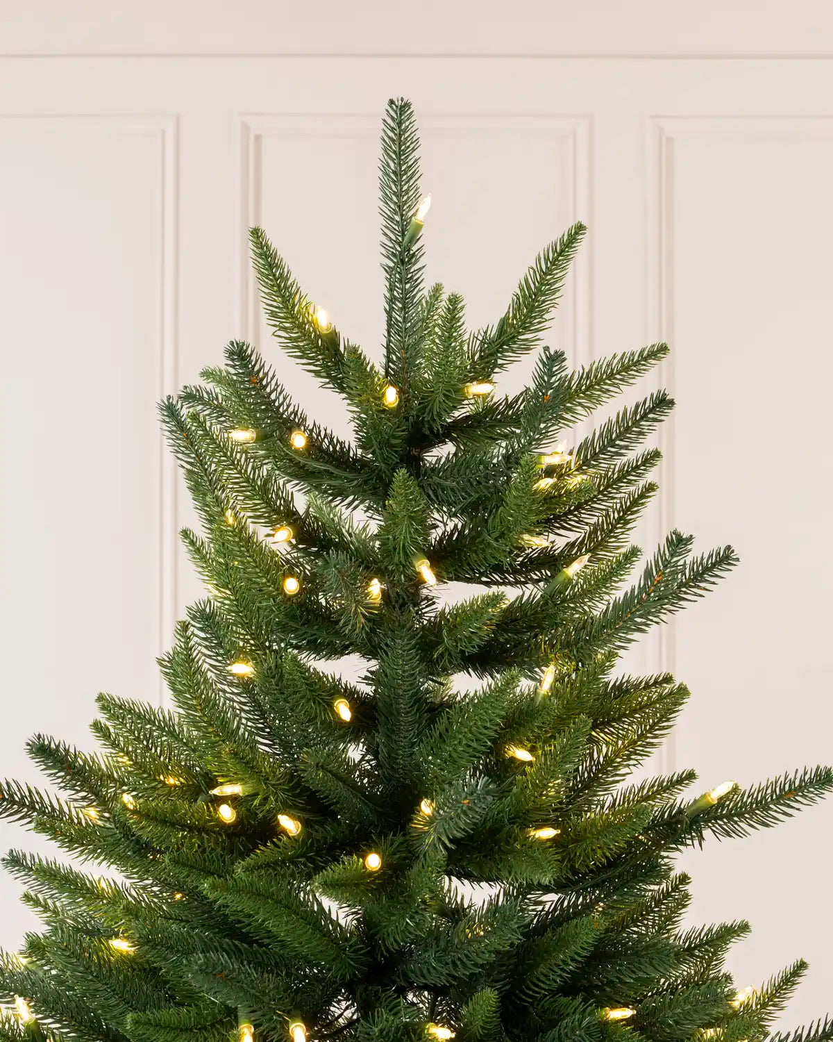 Upper section of the Pre-Lit Hawthorn Spruce Christmas Tree showing full branches