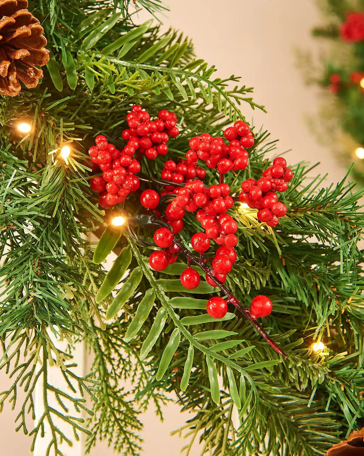 Close up Christmas garland red berries on a neutral background