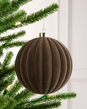 15 cm Mocha oversized velvet Ribbed bauble hanging from a Christmas tree with a gold cap.
