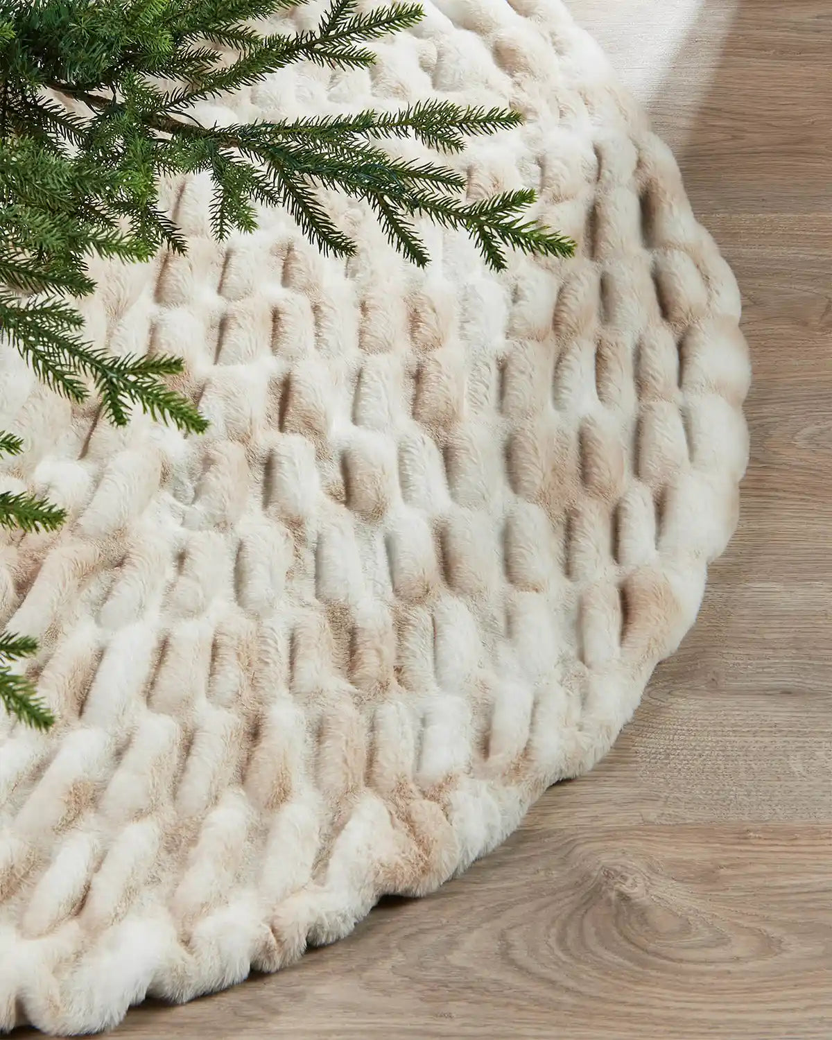 White and Beige Christmas tree skirt on a wooden floor under a Christmas tree