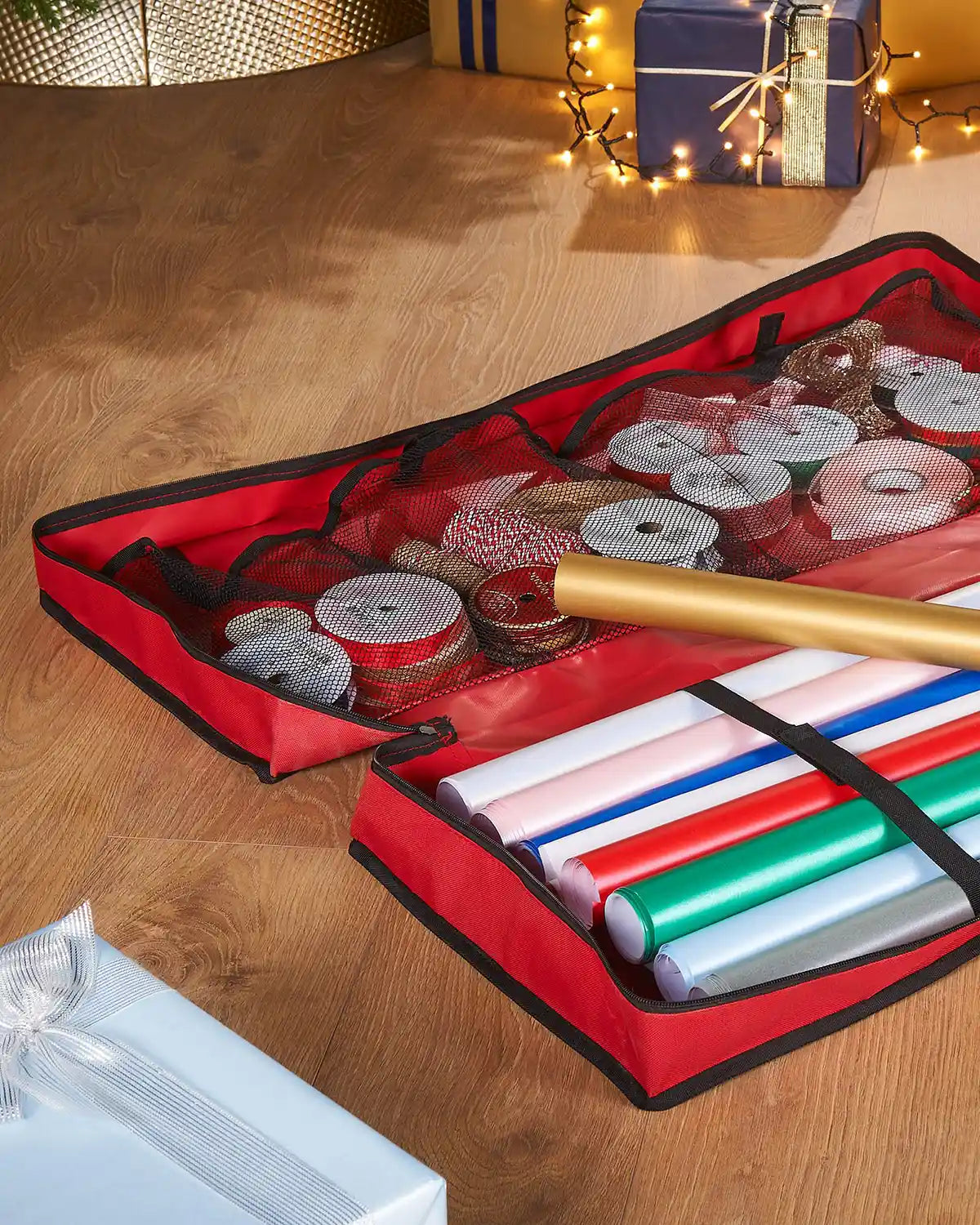 Close up of inside a Wrapping Paper Storage Bag open with wrapping paper ribbon and a mesh lining 