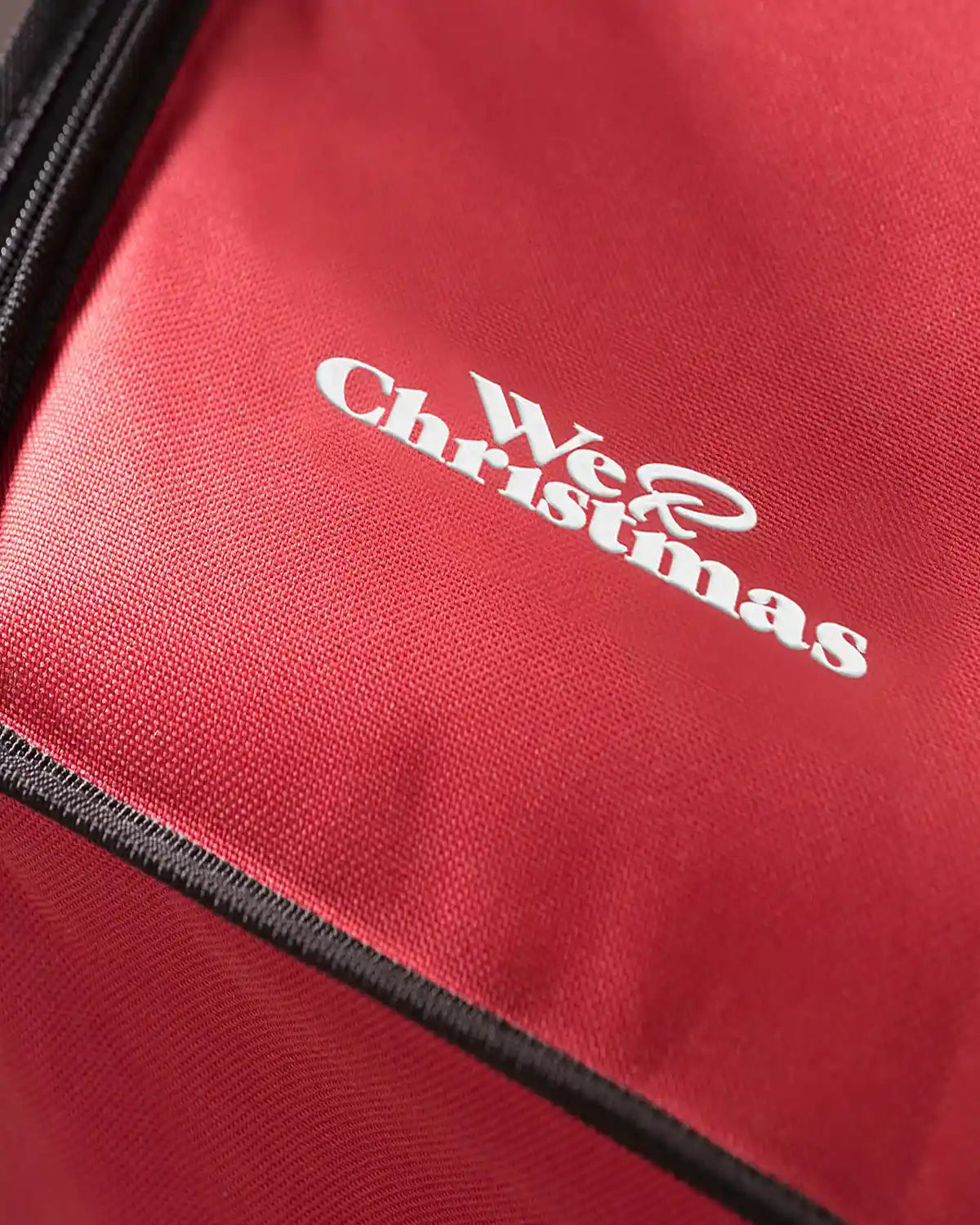 Close-up of the red storage box fabric and logo detail