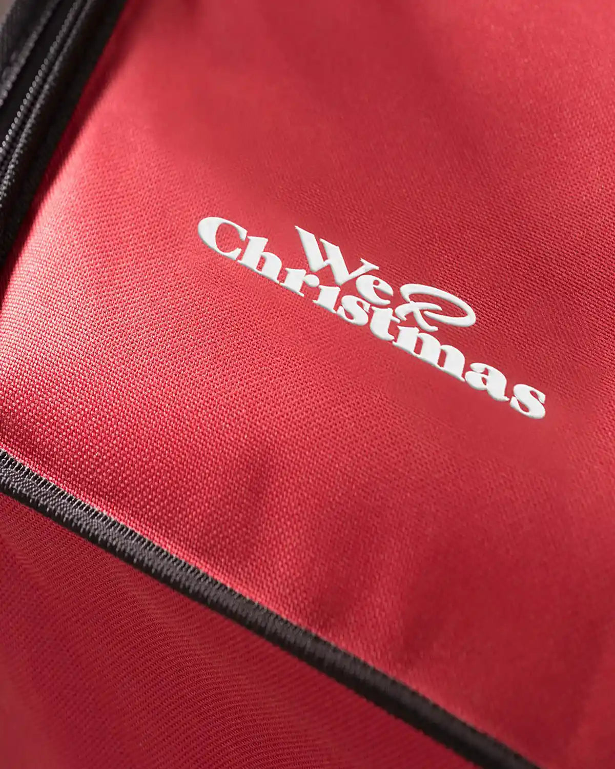 Close-up of the red storage box fabric and logo detail