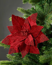 32 cm burgundy artificial poinsettia flower displayed in a Christmas tree, with velvet-textured petals and red glitter accents.