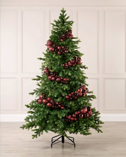 Burgundy bauble cluster arch styled around a green Christmas tree with shiny, matt and glitter baubles.